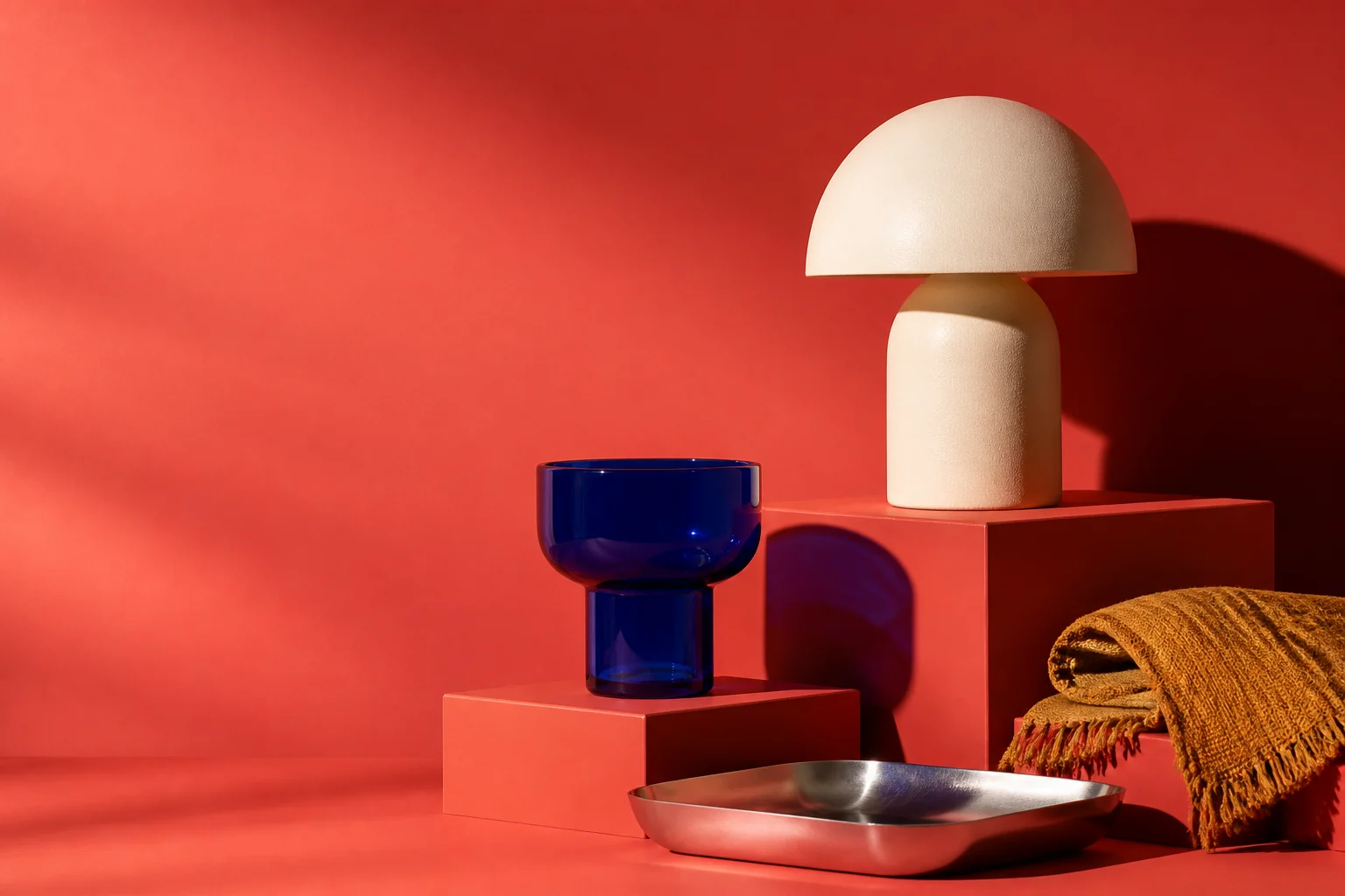 Sculptural home objects on a coral studio set